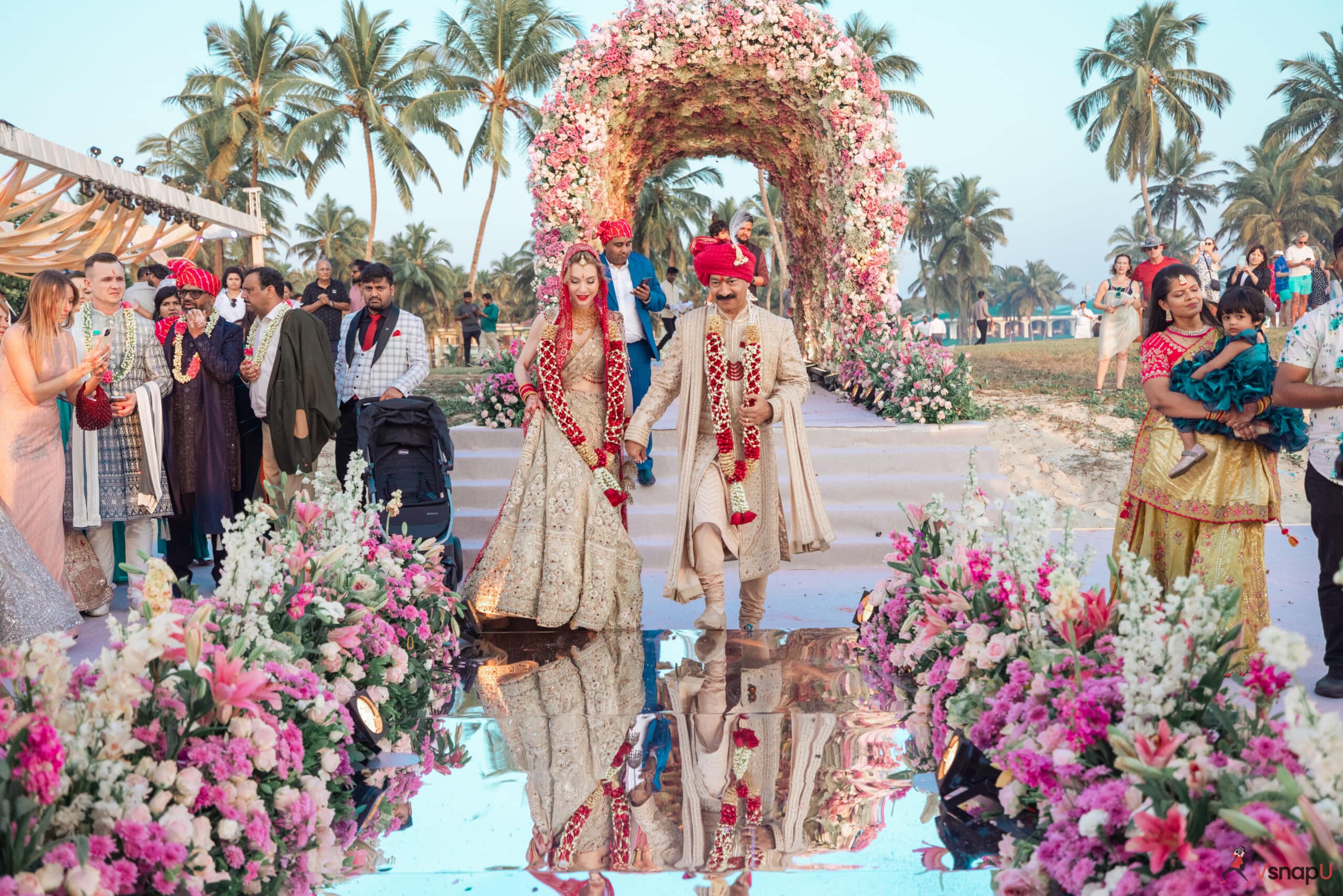 Bride and groom make an enchanting entrance at their wedding destination.
